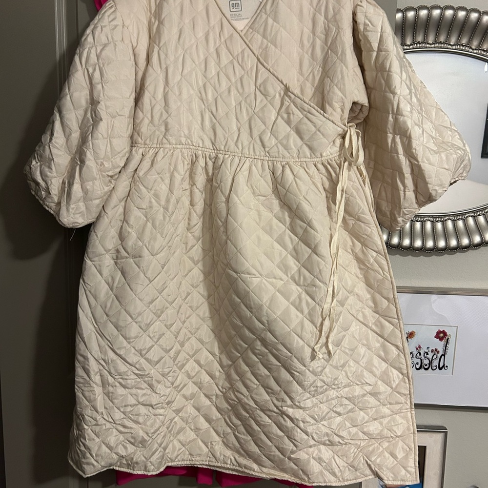 Can be worn as a dress or top.